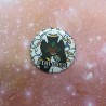 A closeup of the 25mm badge