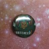 A closeup of the 25mm badge