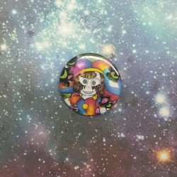 A closeup of the 25mm badge.